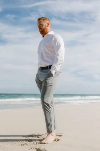 groom at the beach waiting for the bride, they will elope only with their close friends. 