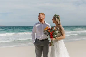 couple eloping in a blue water beach in Los Cabos.
