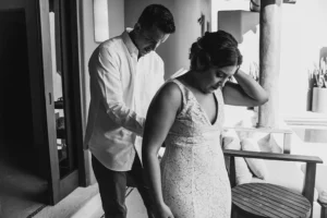 couple getting ready together at their resort before their elopement, is a black and white photo.